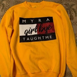Delta Sigma Theta yellow sweatshirt.